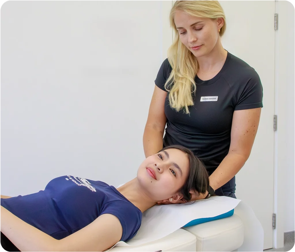 Patient receiving tension-reducing neck and head physiotherapy treatment for migraine relief at Sno Clinics Abu Dhabi - Snö Clinics | Abu Dhabi