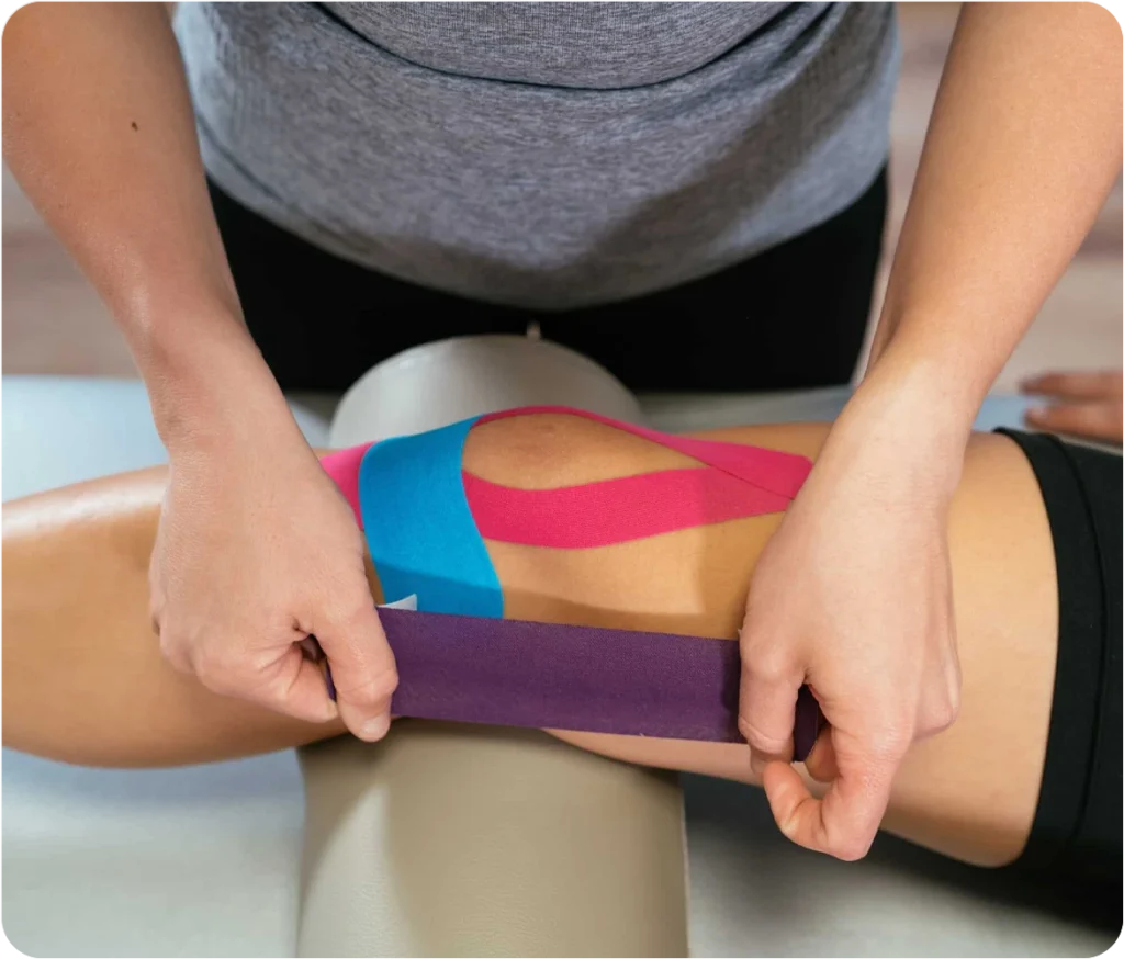 Patient undergoing kinesiotaping as part of a physiotherapy session at Snö Clinics Abu Dhabi to aid rehabilitation - Snö Clinics | Abu Dhabi