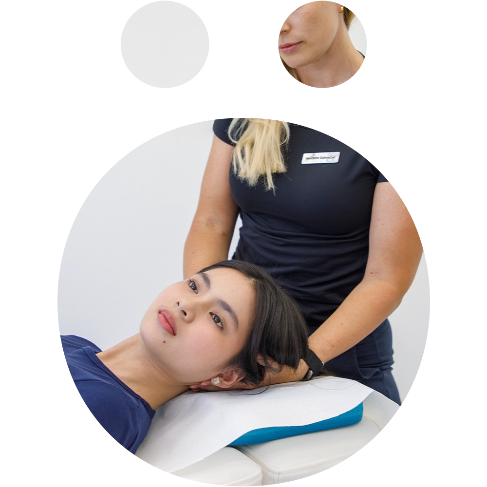 Physiotherapist performing manual therapy on a patients neck to relieve pain at Sno Clinics Abu Dhabi - Snö Clinics | Abu Dhabi Physiotherapist performing manual therapy on a patient’s neck to relieve pain at Sno Clinics Abu Dhabi.