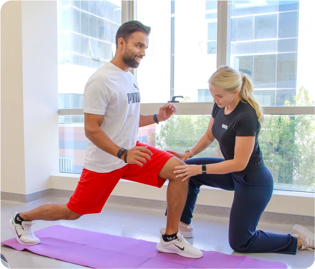 Physiotherapist treating knee pain at Snö Clinics Abu Dhabi rehab for ligament injuries and osteoarthritis - Snö Clinics | Abu Dhabi